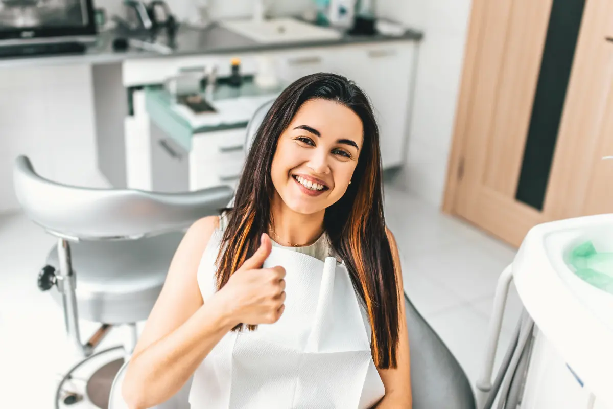 happy patient after receiving emergency dental care
