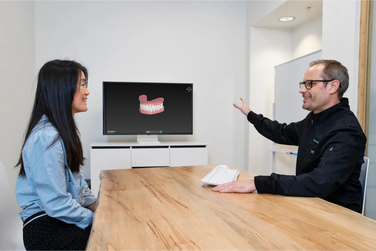 Dr. Leedy showing a patient their digital smile